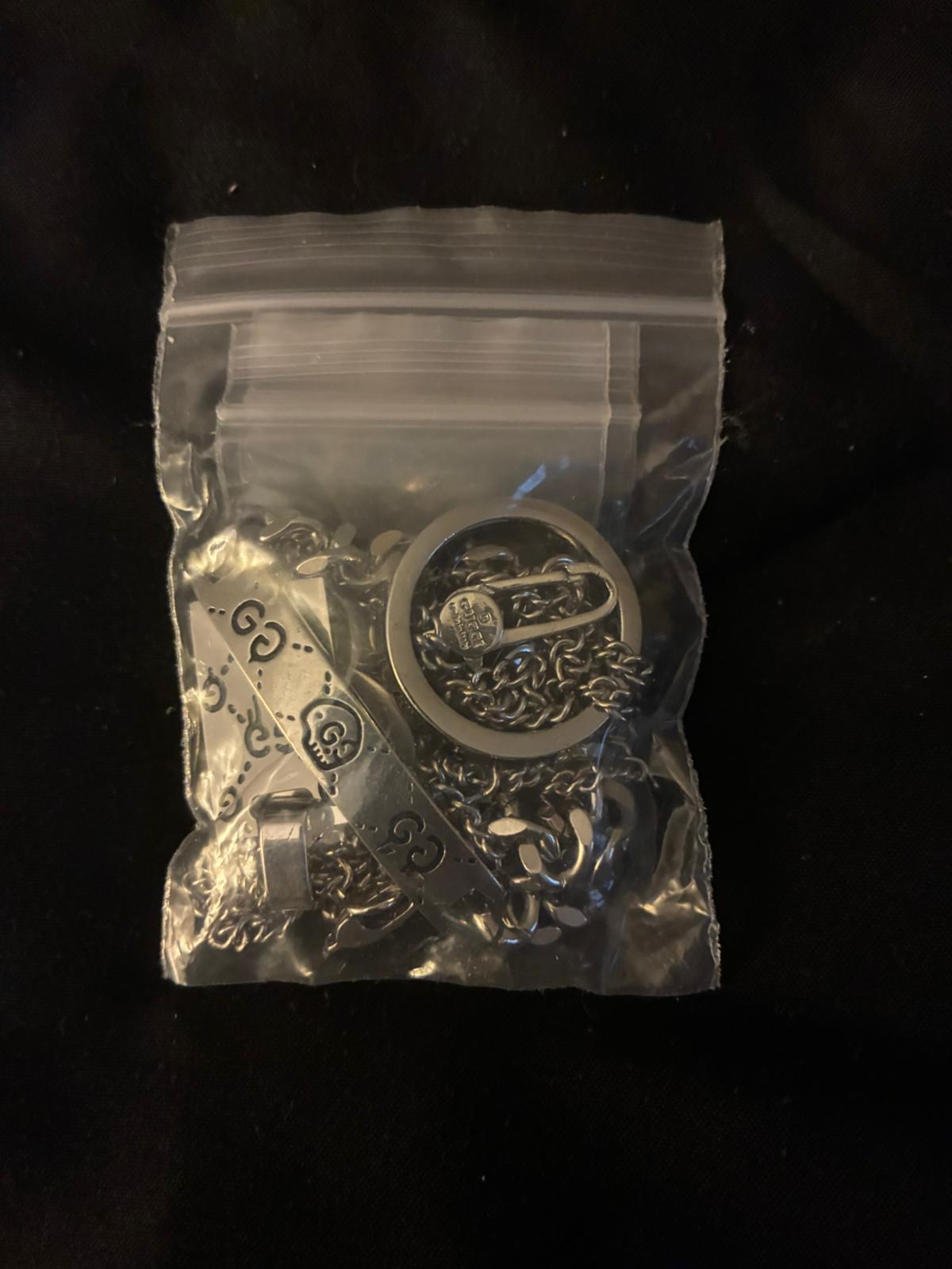 Gucci sterling jewelry packed inside a clear zip bag