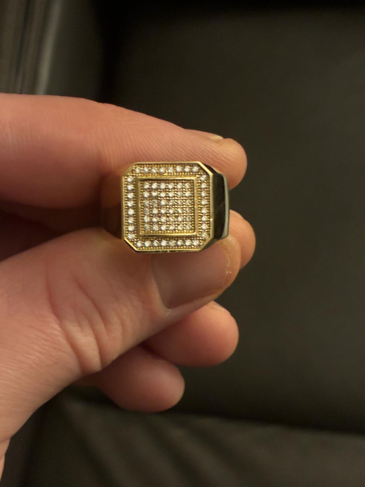 Gold signet ring with pavé face and black enamel shoulders