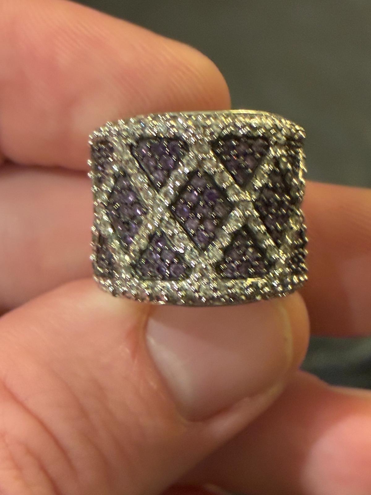 Wide sterling ring set with purple stones and diamond lattice