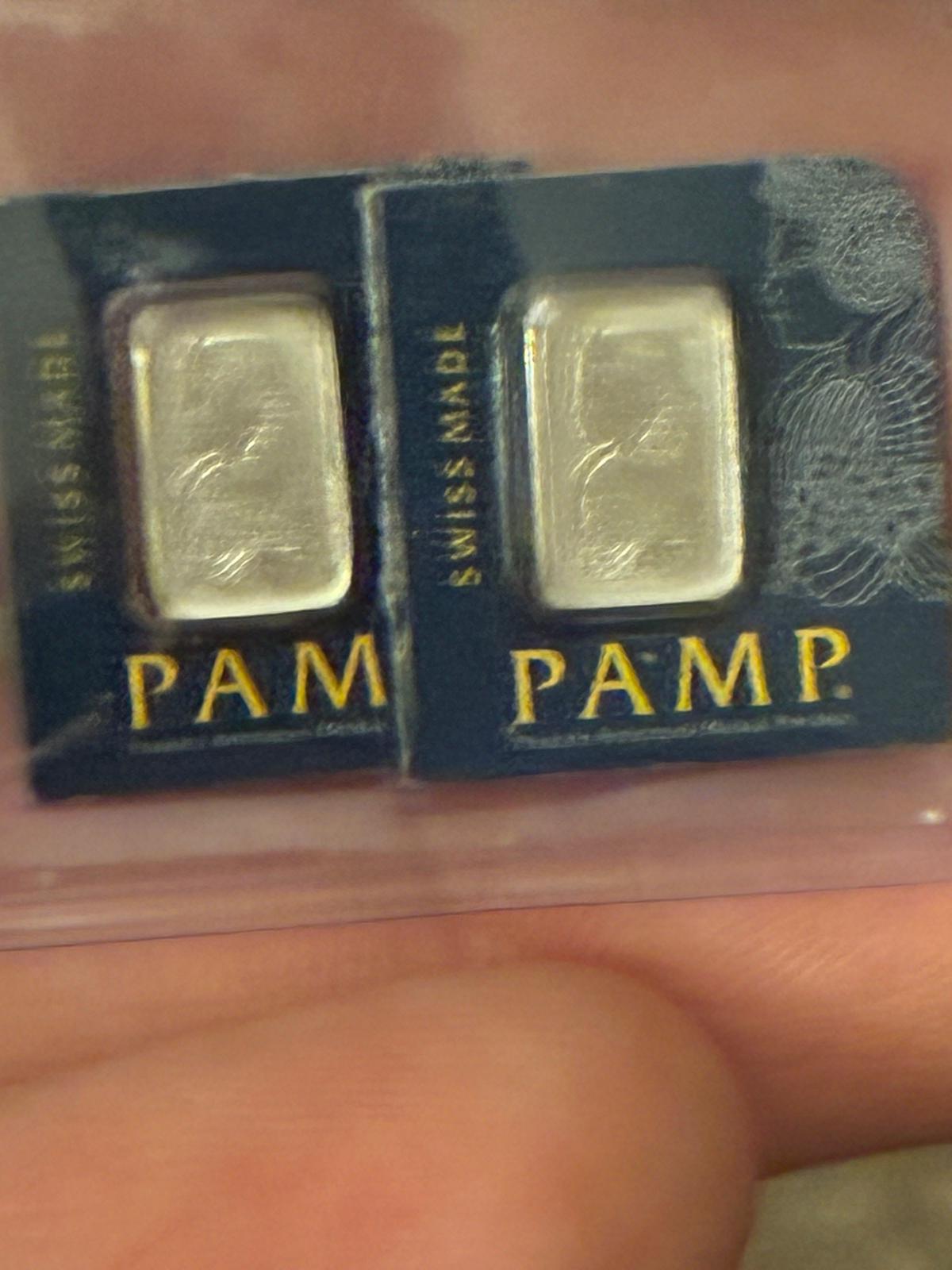 Pair of PAMP Suisse bullion bars sealed in blue assay cards